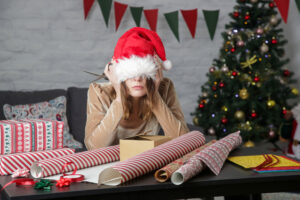 woman overwhelmed by holiday tasks